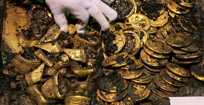 Valuable gold plates and coins were unearthed at a 2,000-year-old royal tomb