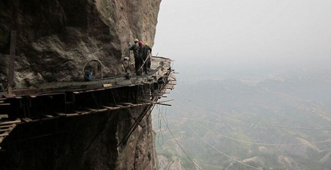 Meet the Workers Building a 3ft-Wide Wooden Road on a Vertical Cliff Face: Is This the World’s Scariest Job?